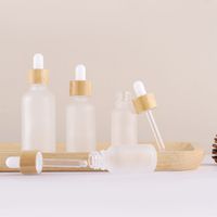 Wholesale Frosted Clear Face Cream Lotion ELIQUID Glass Dropper Bottles Refillable Cosmetic Container ml Wooden Lids