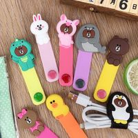 Wholesale Laser transparent Sundries cartoon desktop phone cord winder headset clip charger manager management wire holder silicone seat