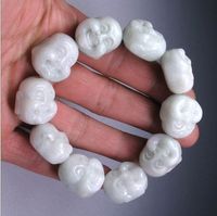 Wholesale Hand carved jade Buddha rubber band strings into a bracelet A successful man s favorite