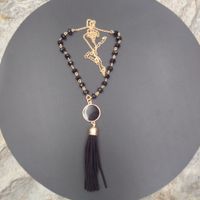 Wholesale Western style tassel pendant chain hand faceted glass edging black suede vinyl enamel disc necklace