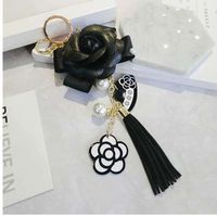 Wholesale Famous Keyring Black White Leather Camellia Flower Keychain Women Fashion Flower Key Chains llaveros flore Bag Charms