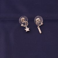 Wholesale European and American style earrings are miniature and personal asymmetrical star moon brass earrings are sweet and refreshing