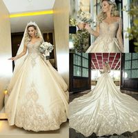 Wholesale illusion long sleeve wedding dresses luxury ivory lace beaded sparkly robe de marriage bride garden wedding gown plus size