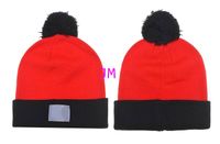 Wholesale 2019 luxury fashion knitting cotton hats wool hair ball with strips orange high quality Beanie cap women s men winter confortable warm hats