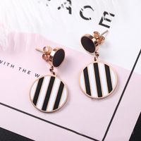 Wholesale Letter hanging surface tassel earrings black and white vertical strip two yuan diamond hollow earrings four leaf clover pearl earrings