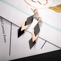 Wholesale Four leaf clover round cake hanging three curved surface long tassel stick earrings triangle circle string hollow ring earrings jewelry