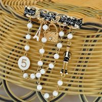 Wholesale Rhinestone Pearl Pins Brooch Fashion Cloth Twisted Pearl Brooches for Women Fashion Coat Link Pins Hanging Style Brooch Summer Jewelry