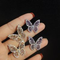 Wholesale S925 silver needle Korea hollow pink butterfly temperament earrings lady ladies ladies wild super fairy earrings gift