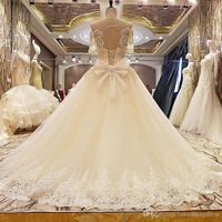 Wholesale New Design Beach Wedding Dresses White Lace Applique Shining Beaded Wedding Gowns Illusion Short Sleeve Open Keyhole Back Bridal Gowns