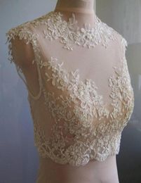 2016 delicate kanten bruidsjassen juweel nek dop mouwen illusie -appliques tule witte ivoor champagne bruids schouders bolero wrap3520992