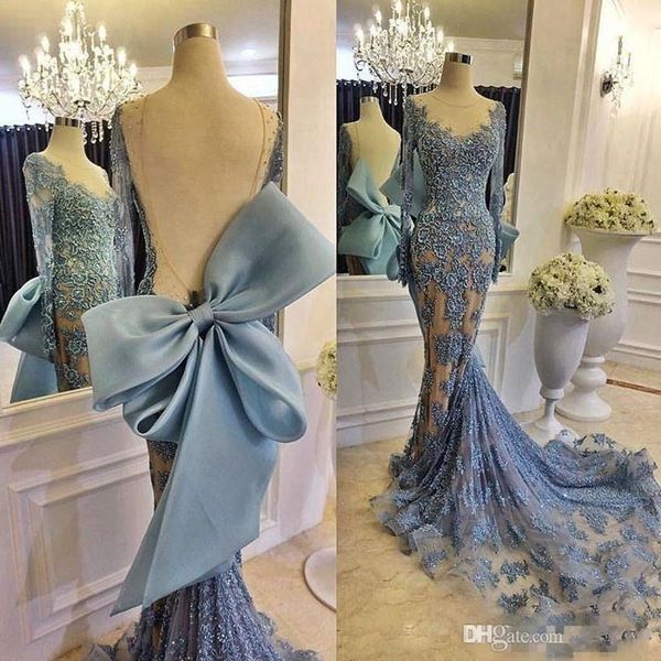 2019 Vestidos de noche formales para celebridades con un gran lazo Mangas largas transparentes Cordón azul cielo Tren de cola de pez Vestidos de fiesta de graduación Modest Zuhair Murad