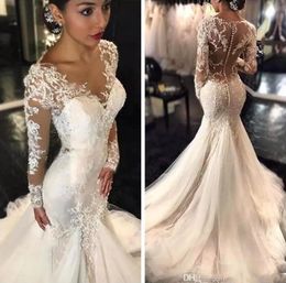 2020 magnifiques robes de mariée sirène Dubaï style arabe africain manches longues en dentelle robes de mariée en queue de poisson bouton robe de mariée