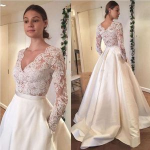 2018 Vestidos de novia de princesa con cuello en V Tallas grandes Ilusión Manga larga Ver a través de Diseñador con bolsillos Satén Corte Tren Vestidos de novia baratos