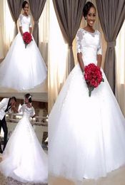 2019 Aline Vestidos de novia sudafricanos para niñas negras Cuello transparente Media manga Botón Volver Vestidos de boda nupciales de talla grande Novia Dres4179152