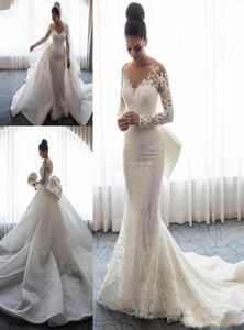 2019 Designer lange mouwen zeemeermin trouwjurken pure nek illusie kanten applique boog buiging overkirts knop terug chapel trein brida6290161