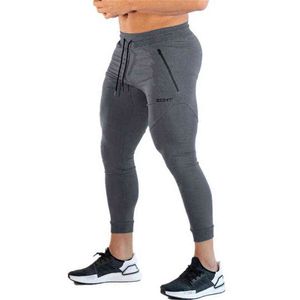 2019 nouveaux gymnases pantalons pour hommes Joggers pantalons de survêtement maigres collants pantalons de survêtement pour hommes côté fermeture éclair pantalon transparent G220713