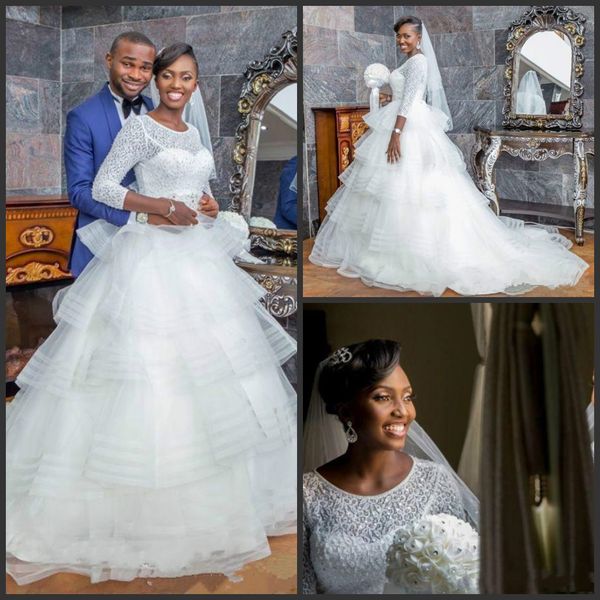 2020 Nuevos vestidos de novia de Nigeria Cuello joya Mangas largas Vestidos de novia de encaje Faldas con gradas Vestido de novia bohemio de playa de talla grande