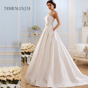 2020 A Line Wedding Dresses Vintage Pockets Bow China Vestidos De Novia Backless Plus Size Button Bride Bridal Gowns