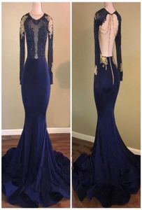 2020 Afrikaanse marineblauwe zeemeermin prom -jurken Sheer Jewel Neck Backless Long Mouwen kralen Gold Lace Applsique Zie maar avond G3481646