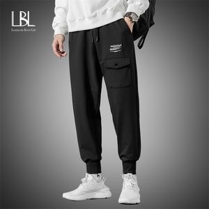 Pantalon de survêtement de streetwear de mode masculins pour hommes de sport causal pantalon solide décontracté hommes pantalons de survêtement hip hop poche LJ201103