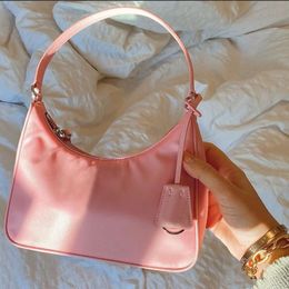 Sac à bandoulière en nylon à la mode pour hommes et femmes, sac à main et sac à main de luxe, fourre-tout, sacs à bandoulière en cuir véritable, sac de styliste rose de voyage