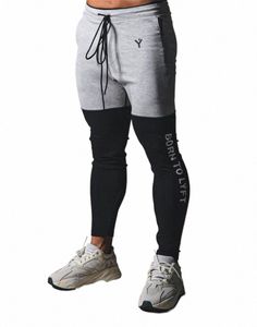 2020 nueva marca pantalones flacos para hombre gimnasio patchwork fitn masculino corriendo pantalones de pista joggers pantalones de chándal hombres pantalones de entrenamiento deportivo x4c6 #
