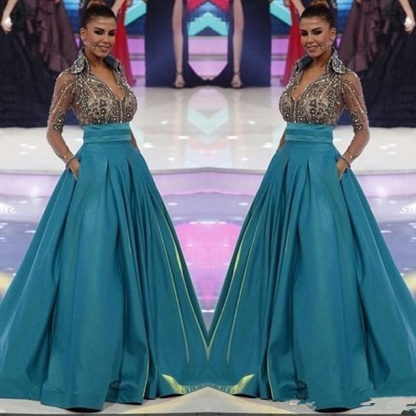 2020 Nuevo Miss World Manga Larga Vestidos de noche Formal Sheer Cuello con cuello en V Abalorios Pago con bolsillos Mujeres Formal Use vestido de fiesta