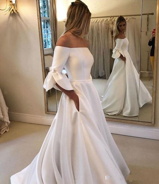 2020 Simple Vintage Nuevos vestidos de novia Una línea de hombro Medias mangas Satén con bolsillo Tallas grandes Botón largo Volver Vestidos de novia formales