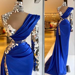 2023 Arabic Prom Dresses Aso Ebi Luxurious Beaded Crystals Royal Blue Illusion High Neck Evening Dress Sheath One Shoulder Split Mermaid Formal Party Gowns