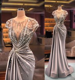 2021 Arabe Sexy Luxe Robes De Bal Jewel Neck Illusion Cap Manches Cristal Perles Paillettes Bling Robe De Soirée Formelle Robe De Soirée1810646