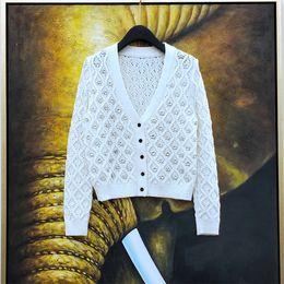 Otoño nuevo diseño de mujer ahueca hacia fuera el punto de manga larga de retazos de diamantes de imitación suéter de lujo cárdigan abrigo SML