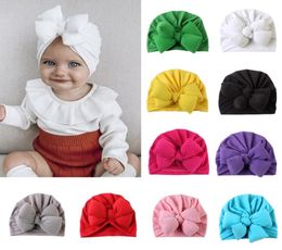 2021 Leuke baby babyknoop Indiase tulband kleurrijke baby's donut hoed vaste kleur katoenen haarban voor kinderen peuter kinderen hoofdtooi7809104