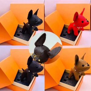 2021 diseñador Animal de dibujos animados perro pequeño llavero accesorios llavero PU cuero carta patrón coche llavero joyería regalos con caja