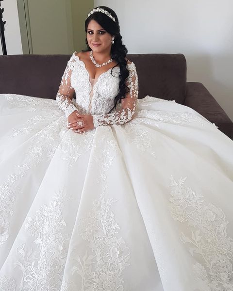 2021 Magnífico árabe Aso Ebi A Line Vestidos de novia Vestido de novia Tallas grandes Lujoso Encaje Cristal Con cuentas Mangas largas Vestidos de boda vintage Corsé Volver Vestido de fiesta