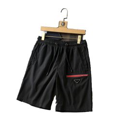 2021 Hombres Mujeres Diseñadores Pantalones cortos Moda de verano Ropa de calle Ropa de baño de secado rápido Tablero de impresión Pantalones de playa M-3XL # 44