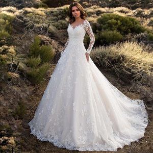 2021 Nueva Dubai Elegante Manga larga Una línea de vestidos de novia Sheer Cuello redondo Apliques de encaje Con cuentas Vestios De Novia Vestidos de novia wit271w