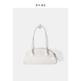 2021 nouvelle conception de la minorité coréenne en cuir verni couleur bonbon boulette sac femmes tendance texture polyvalente une épaule aisselle