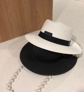 2021 lente en zomer nieuwe high-end gevlochten strohoed Franse socialite stijl mode temperament met parel ketting temperament dames hoed