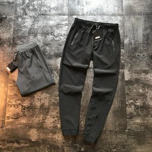 2021 États-Unis Sports Joggers Designer Pantalons de luxe Pantalons pour hommes Printemps Voyage Énergique Haute Qualité Coton Outillage Pantalon de course