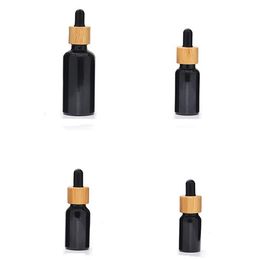 2021 flacons compte-gouttes de teinture en verre noir naturel résistant aux UV avec couvercle en bambou 10ML 15ML 30ML 50ML 100ML bouteille d'huile essentielle