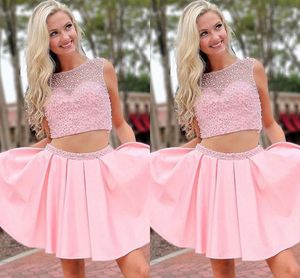 2022 Leuke roze homecoming jurken 2 stuks hard werkende kralen boot halslijn pure cap sleeves a-line gradlaution prom feestjurk meisjes