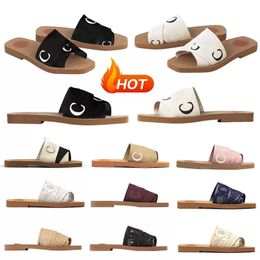 2022 zapatillas de diseñador mujeres Woody Mules sandalias planas diseñadores diapositivas zapatillas de deporte zapato de lona blanco negro rosa azul marino moda al aire libre playa zapatilla