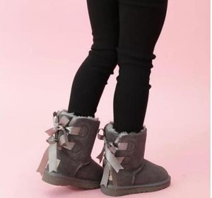 2022 Bottes de neige pour enfants Chaussures de créateurs d'hiver en cuir véritable 2 Bows Bottes pour enfants Chaussures pour tout-petits Chaussures de marque de marque EU21-35 Sable de châtaignier