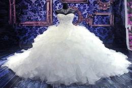 2022 Robes de balle de perlé de luxe Robes de mariée robes nues princesse chérie corset organza volant cathédrale vestido de n1411802