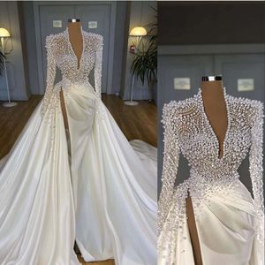 2022 Luxe Bling Zeemeermin Trouwjurken Diepe V-hals Illusie Parels Kristal High Side Split Arabisch Satijnen Bruidsjurken Robe de mari￩e Grote maten Lange mouwen