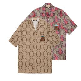 2022 Hombres Mujeres Camisas casuales Verano Hawaii Estilo Botón Solapa Cardigan Manga corta Camisa de gran tamaño Blusas Tops Marca Diseñador Diseño Top suelto