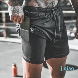 2022 Nuovo arrivo Estate Double-Deck Pantaloncini da uomo Fitness Bodybuilding Traspirante Asciugatura rapida Palestre corte Uomo Pantaloni casual Pantaloni al ginocchio