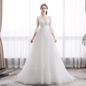 2022 Nuevo Dubai Elegant Long Lace A Vestidos de novia de boda de línea transparente Flores de cuello Apliques Vestios con cuentas de novia vestidos de novia con botones