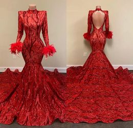 2022 Robes de soirée sirène en dentelle rouge appliquées à manches longues col haut dos nu paillettes queue de poisson aso ebi plumes de fille noire robes de fiançailles de bal