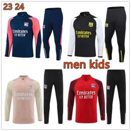 2023 2024 LYON MENS ET KIDS ENFANTS SOCCER SOCCER SOCCER SET survivent 23 24 Lyonnais Tracksuit L. Paqueta Ol Aouar Football Training Costumes Jogging sets